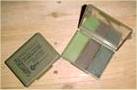 Image: Current British Army issue three-colour camouflage face paint compact.