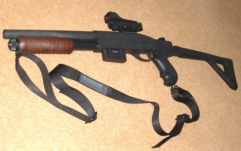 The final form, with rail mounted red dot and Blackhawk sling.