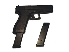 Glock with clip out and spare