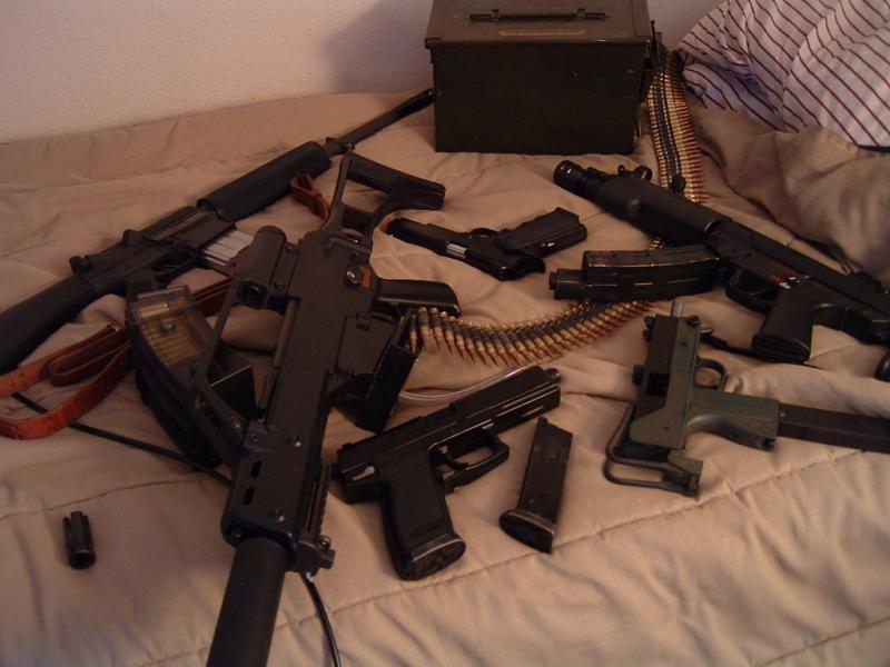 Bunch of my guns on my bed.
