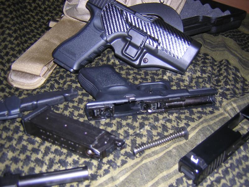 G18c (in holster) and disassembled G19