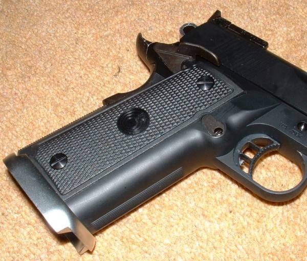 P.O. based on standard 1911 frame, unlike SVs. - Note cutaway mag well.