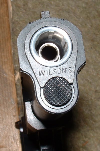 Wilson design features standard 1911 style slide and bushing.
